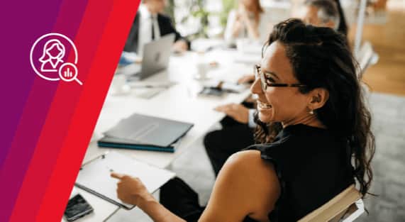 An Ivanti customer smiling at her desk