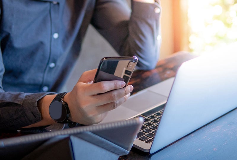 man looking at phone