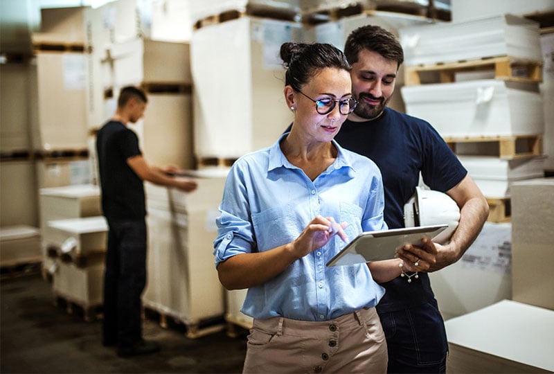 woman and man looking at tablet