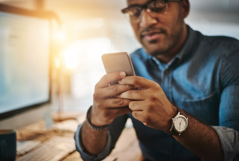 man looking at his phone