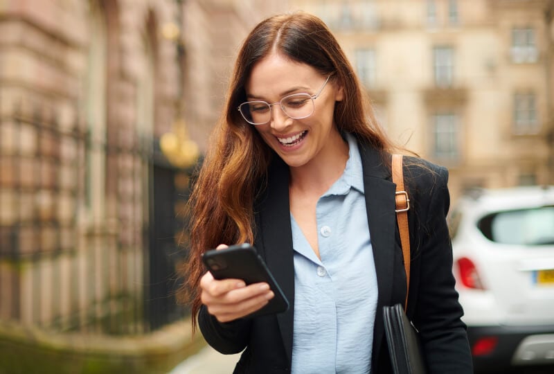 woman looking at her phone